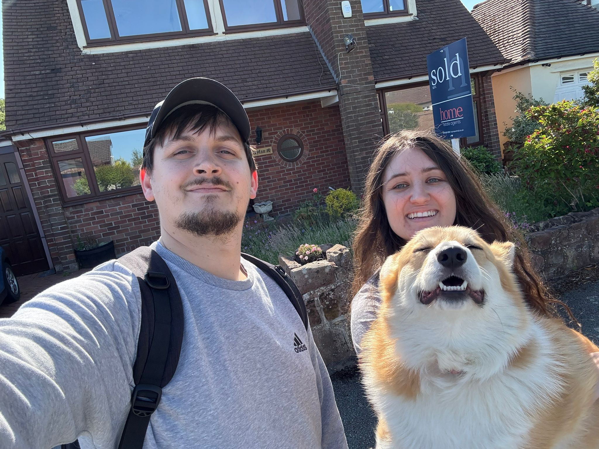 Katie, Conor, and Willow outside their home at the start of a new chapter.